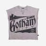 Sleeveless light gray sweatshirt featuring a large vintage-style graphic of "Gotham City" with a bat silhouette and the text "Est. 1939" in distressed black print. A small Batman logo is also present at the bottom right of the design