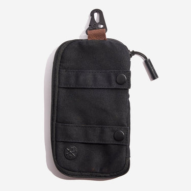 Back of the Mandalorian Tech Organizer Pouch showing straps to button onto other accessories as well as a clip at the top