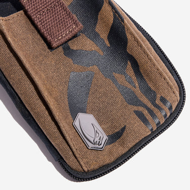 Canvas Tech Organizer with a Mythosaur patterned pouch and metal mudhorn emblem on a white background