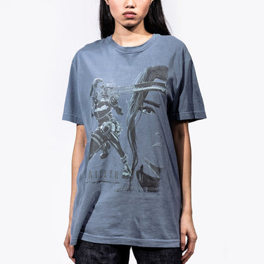 Female Model in a Dark Blue T-Shirt featuring a faded graphic of Caitlyn from Arcane
