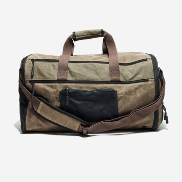 Canvas The Mandalorian Themed duffel bag with brown handles and black luggage strap