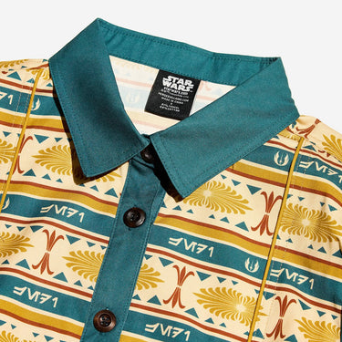 Close up of a button up yellow and teal dress thats star wars jedi inspired with a striped tapestry pattern 