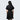 A woman standing backwards in a black dress thats star wars imperial inspired with a geometric pattern 