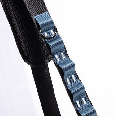 The photo shows a close up detailing of the shoulder strap. Featured is the Blue decorative detailing. The detailing has loops for attaching clips and a tech case. The top loop has a "D"-Ring attached.