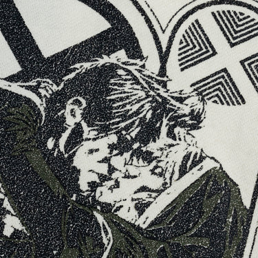 A dip-dyed hoodie in cream and green featuring X-Men's Rogue and Gambit. The front displays a small X-Men logo, while the back showcases a black-and-white comic-style illustration of Rogue and Gambit embracing, with the word "Sugah" below.