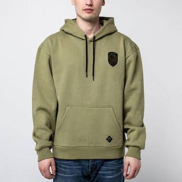The photo is of a man in a Green Hoodie with Kangaroo Pocket and Hood. The Hoodie has a patch on the right chest area and black strings to tighten the hood