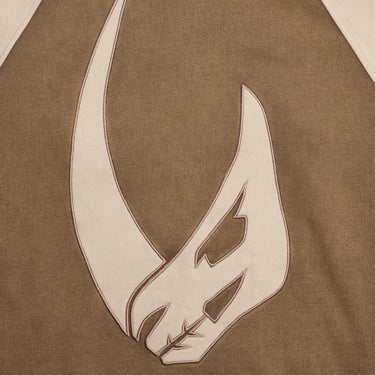 Close up of a Mudhorn patch on the back of a Star Wars Mandalorian Hoodie