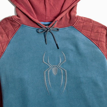 Spider-Man themed pullover hoodie with a blue body, quilted dusty red sleeves and hood, and a silver spider logo on the chest, shown against a light gray background.
