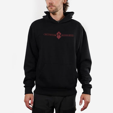 Person wearing a Black hoodie with a red logo reading "Warriors of Mandalore" on a white background