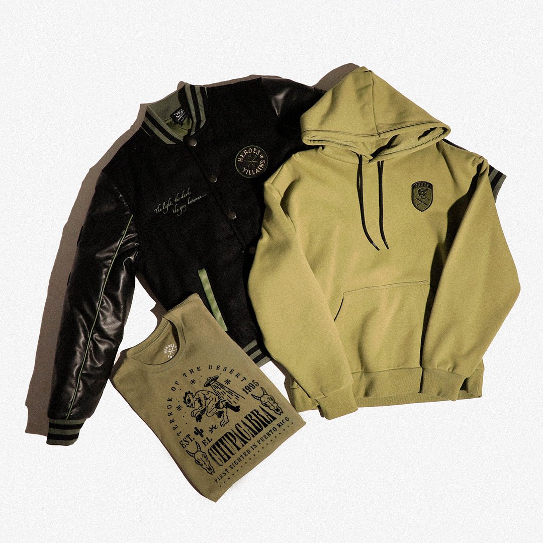 Black leather jacket, green hoodie, and green t-shirt with branding on a white background