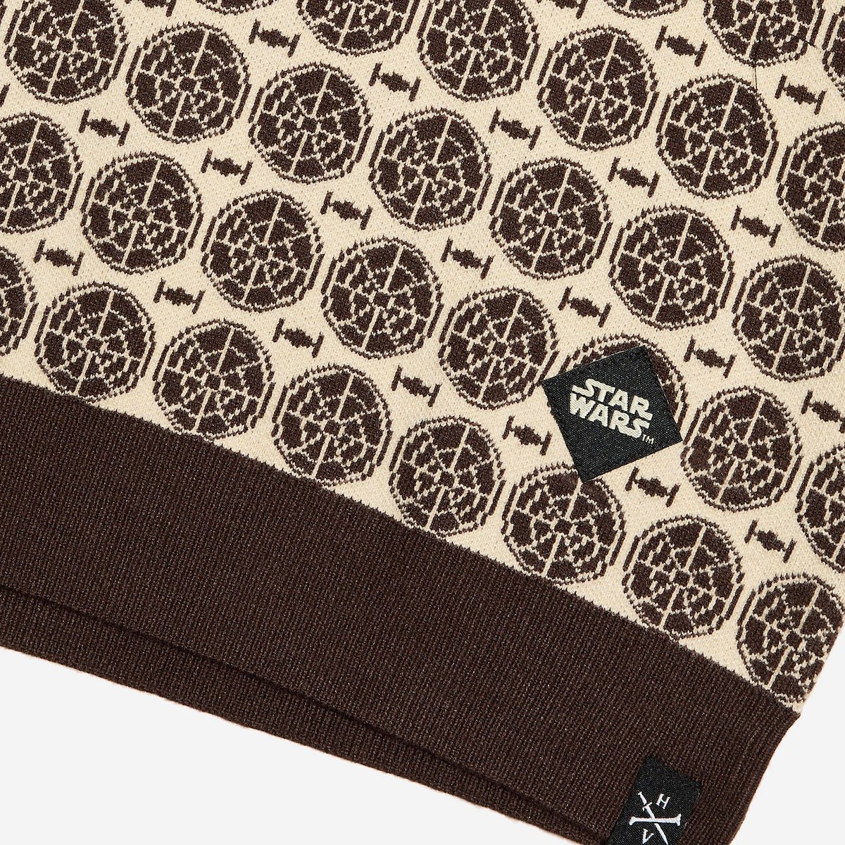 Star Wars patterned fabric with logo on a beige background