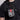 Person wearing a black shirt with a Star Wars themed gray and red bag on their shoulder