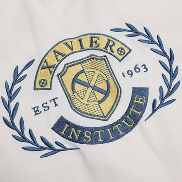 Embroidered logo of Xavier Institute on a white background