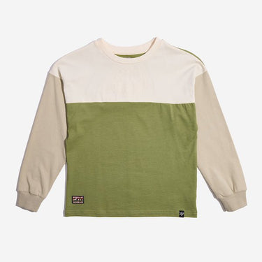 A long sleeve color blocked shirt. The Sleeves are tan while the top panel of the shirt is cream colored and the bottom is an olive green. Photo shows a close up of a t-shirt with white and orange horizontal stripes.   There is a rectangular patch at the bottom left. The  patch has the words "Rebels of" at the top and "Alderaan" at the bottom. Between the words is a small picture of a forest and mountains. 