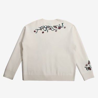 The Back of a White Cardigan featuring embroidered Cherry Blossoms across the top of the back