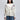 Woman in a White Button Up Cardigan featuring embroidered cherry blossoms