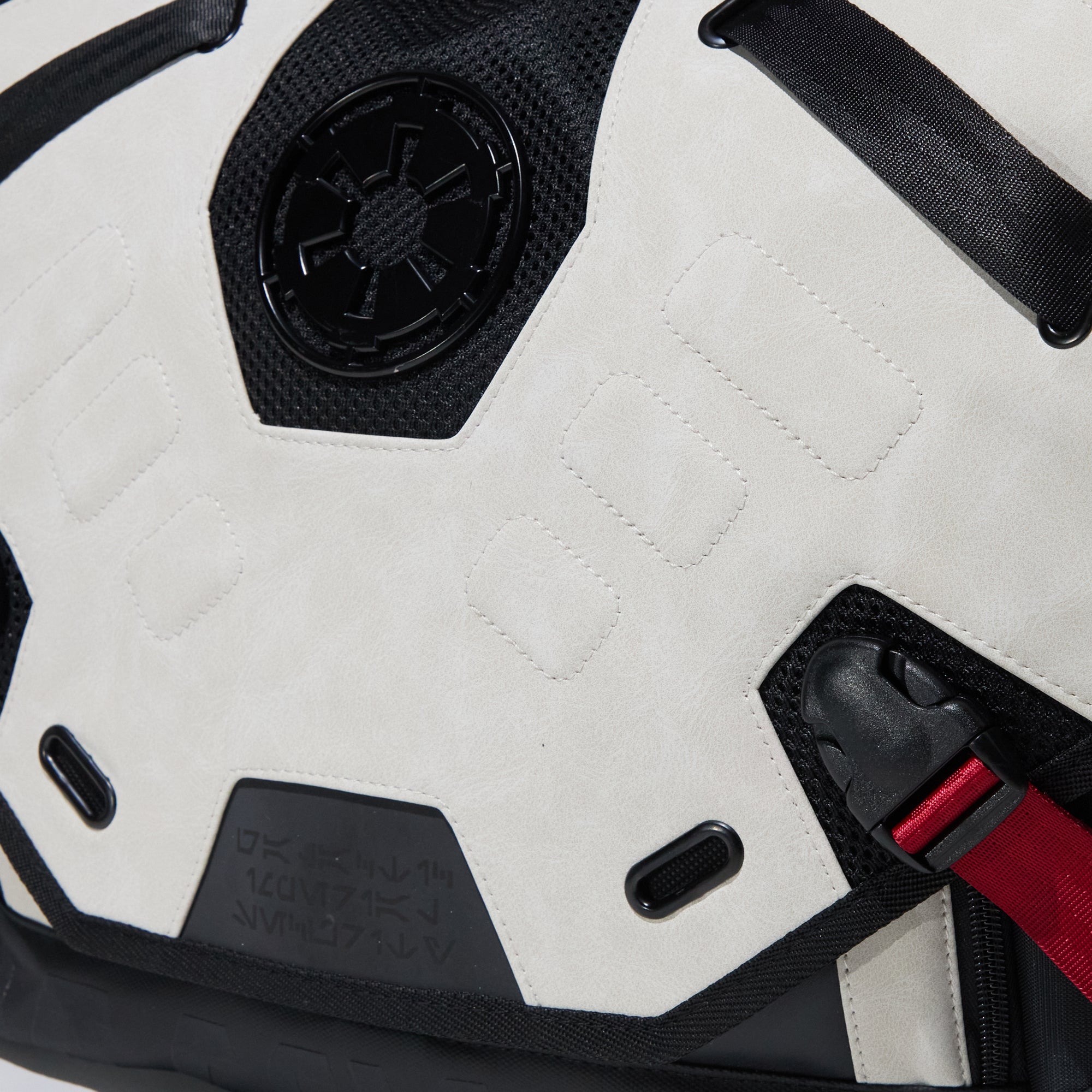 Close up of Heroes & Villains Star Wars Imperial Army Bike Messenger Bag with a white and black design, featuring the Galactic Empire emblem, red strap accents, and a sleek, modern finish.