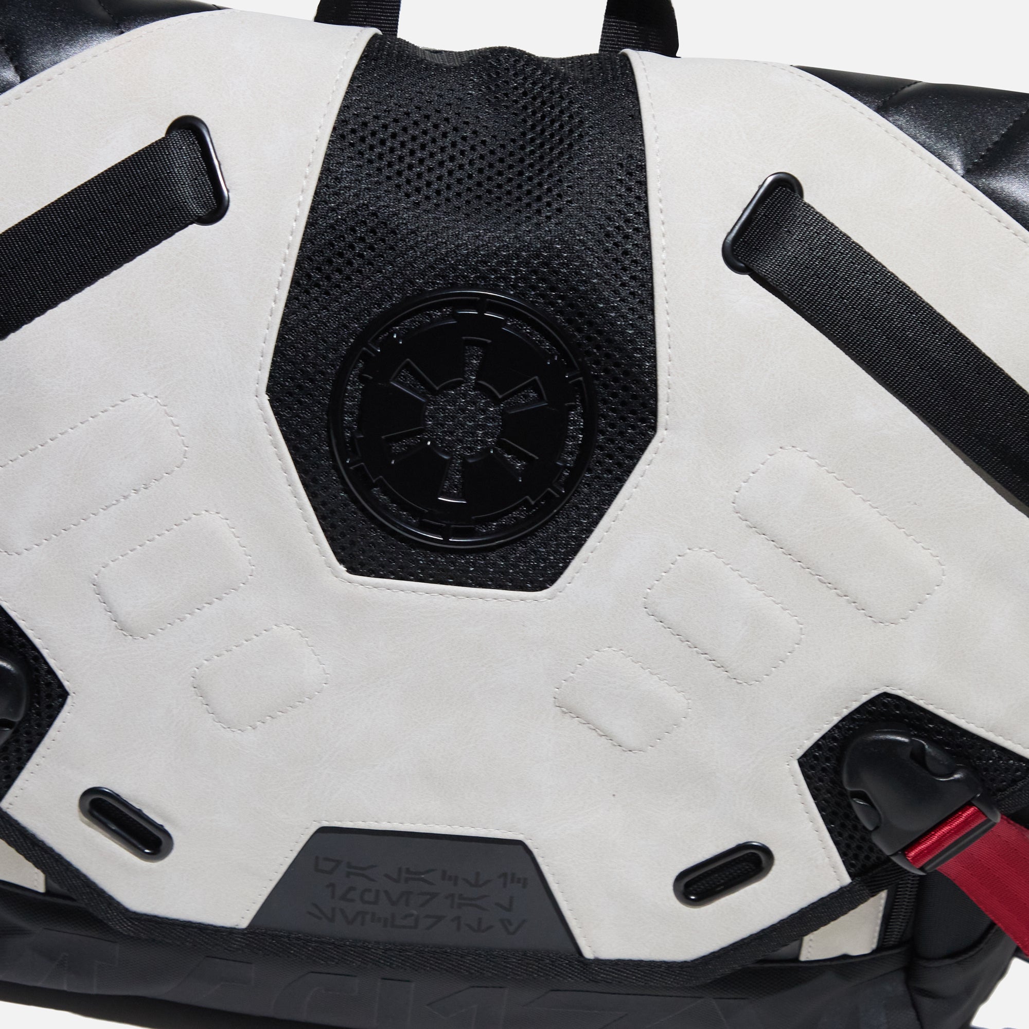 close-up of Star Wars Imperial Army Bike Messenger Bag with a white and black design, featuring the Galactic Empire emblem, red strap accents, and a sleek, modern finish.