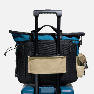 Showcasing the trolley sleeve of the Heroes & Villains Rebel Teal Commuter Bag.