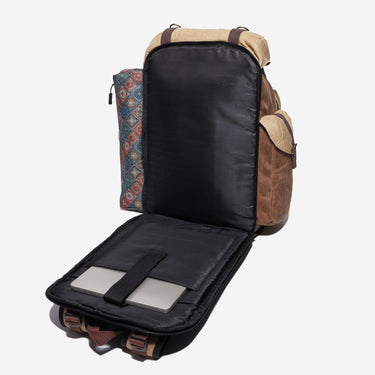 Backpack with a compartment open, revealing a tablet and a patterned pouch on a white background
