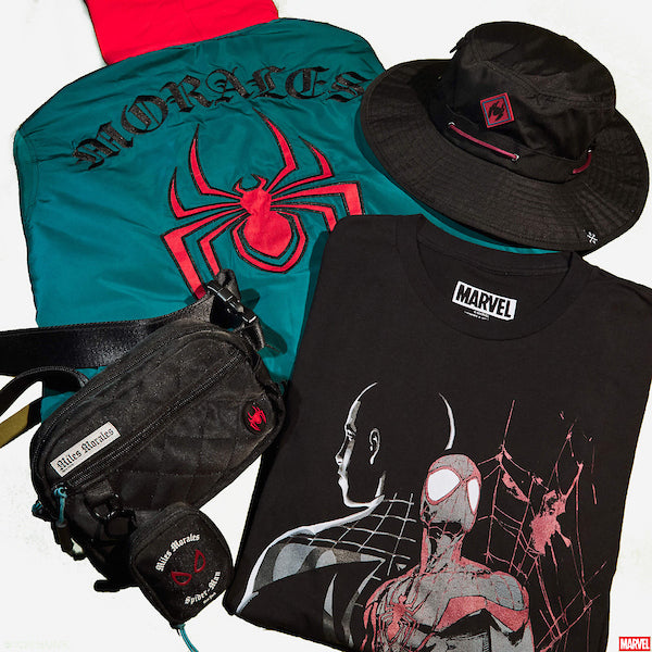 A collection of Miles Morales merchandise featuring a blue jacket, black hat, black t-shirt, and black bag with Spider-Man graphics.