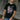 Man wearing Black T-Shirt with Graphic of Magneto from X-Men '97 Animated TV Series in a concrete setting