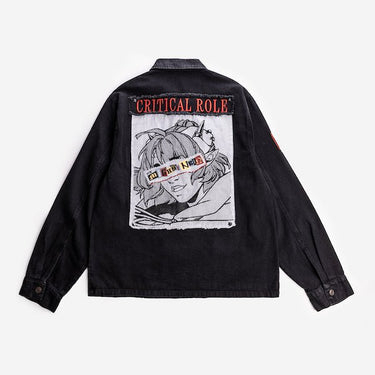 The back of the black denim jacket displays a large embroidered patch featuring an anime-style character with goggles labeled "The Mighty Nein." The character has spiky hair and a confident smile, with the words "CRITICAL ROLE" embroidered in red above the patch.