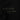 The photo shows up close of green embroidered text on black fabric. It says "The Light, The Dark, The Grey Between"