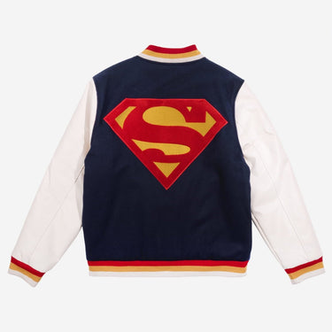 Superman logo on a varsity jacket with navy back and white sleeves.