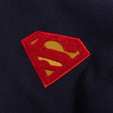 Superman logo patch on a dark background