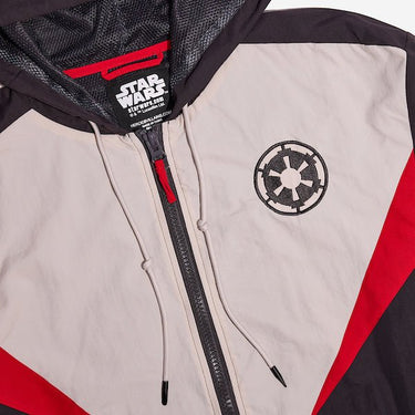 A close up of a Star Wars-themed hooded windbreaker jacket featuring a Imperial Army emblem on the left chest. The jacket has a color-blocked design in Black, White and Red, with a front zipper, adjustable drawstrings on the hood