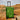 Green Star Wars Grogu Themed suitcase with a grogu face design and mando in desert setting