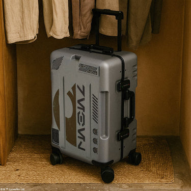 Gray suitcase with a  Star Wars Rebel logo on a wooden floor