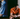 Man wearing an orange star wars performance polo shirt sitting on a bench with a close-up of a blue jedi patterned performance polo
