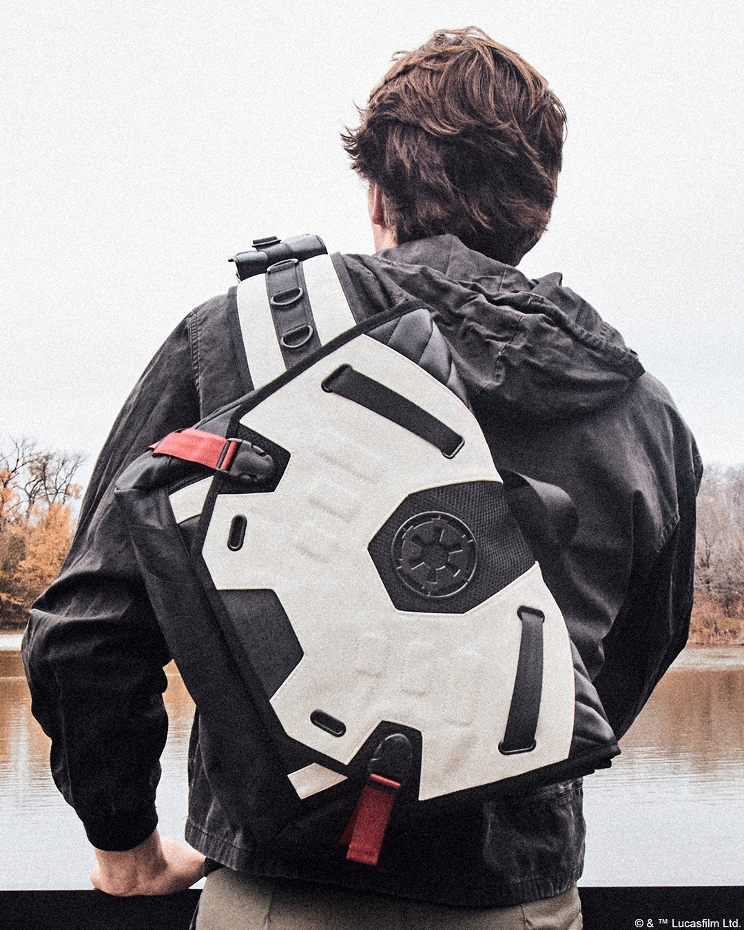 Man showcasing where the Star Wars Imperial Army Bike Messenger Bag hits on the back