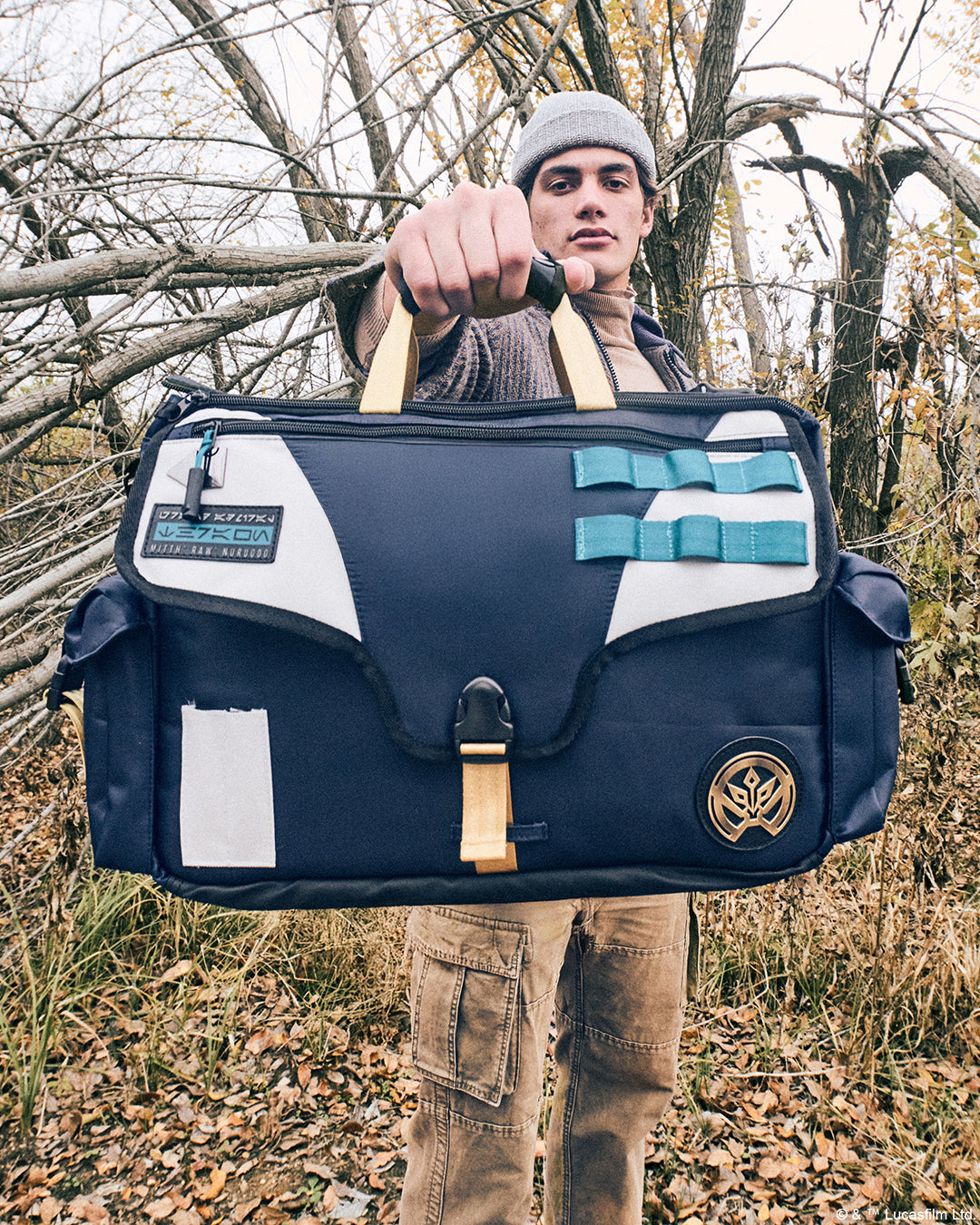 Male carrying the Heroes & Villains Thrawn Bike Messenger Bag in a nature scene.