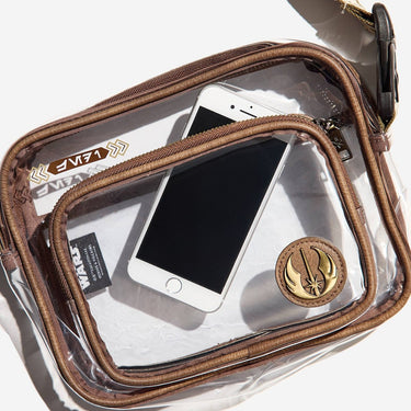Clear pouch with brown zipper and gold jedi emblem containing a smartphone on a white background
