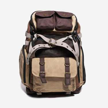 Brown and beige backpack with leather accents on a white background