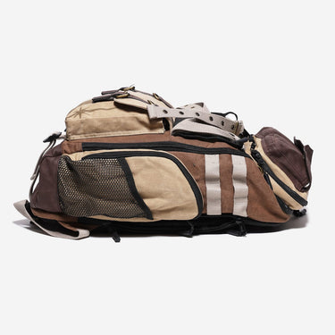 Multicolored backpack with brown, beige, and black straps on a white background