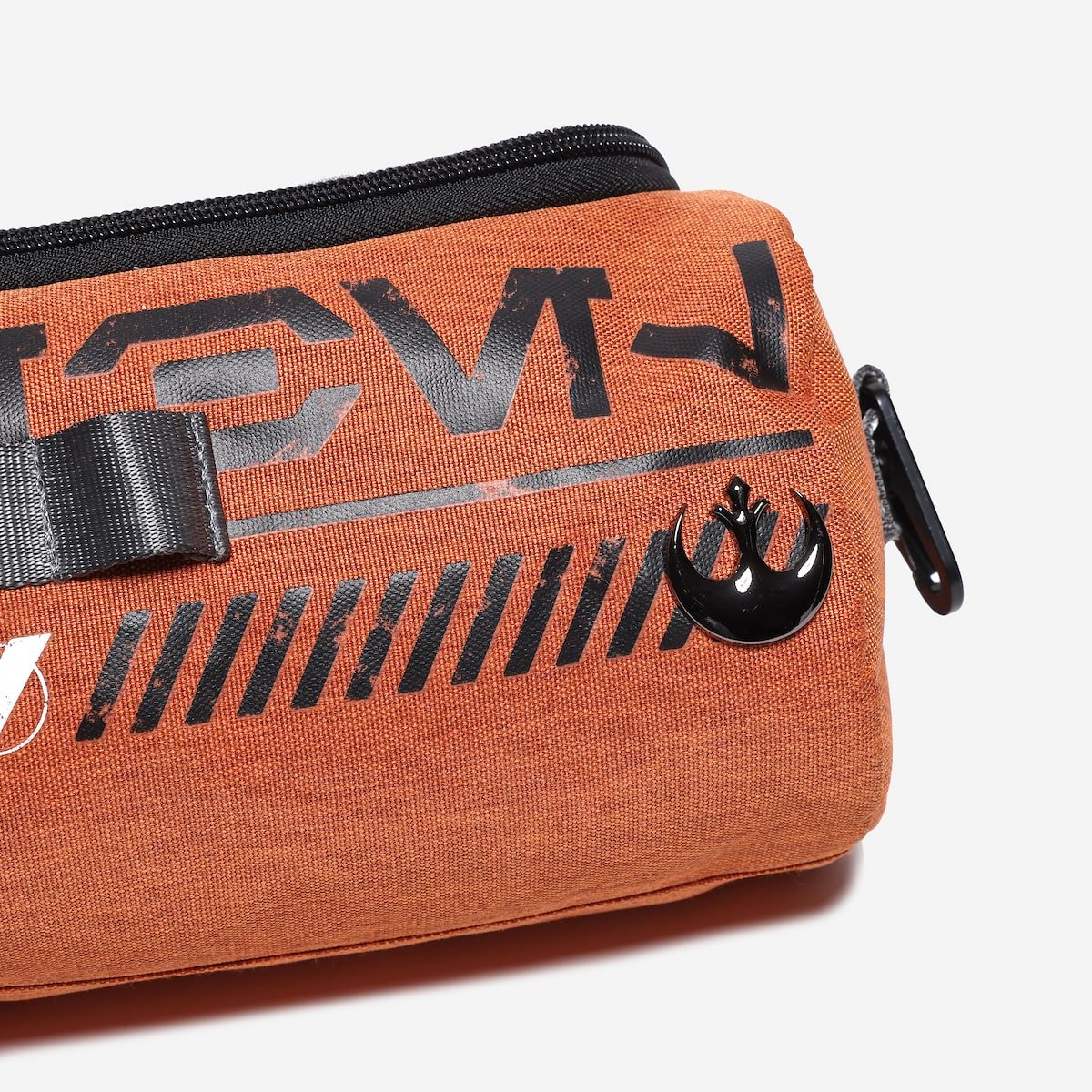 Orange travel pouch with black text and rebel  logo on a white background