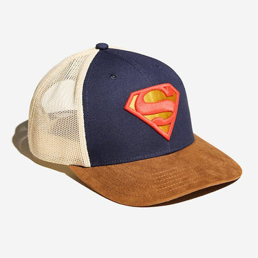 A photo of a trucker hat. It has a white mesh back, a brown suede bill and the front is blue dawning the S-Shield from Supermans uniform