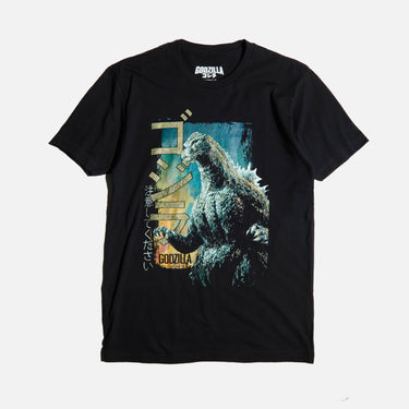 Black colored T-shirt featuring a vintage-style graphic of Godzilla roaring with a distressed design, Japanese text, and green block lettering.