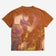 Orange T-shirt featuring a colorful, stylized image of a dragon with abstract, swirling designs.
