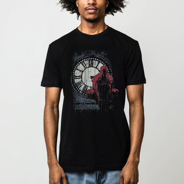A male model featuring a Moody graphic tee featuring Daredevil crouched in front of a weathered clock tower, drenched in rain. The distressed artwork and bold red highlights capture the grit and intensity of Hell’s Kitchen’s vigilante.








