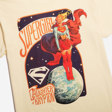 T-shirt with Supergirl graphic design on a beige background