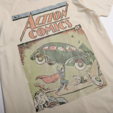 White T-shirt with 'Action Comics' Superman No.1 graphic design on a beige background