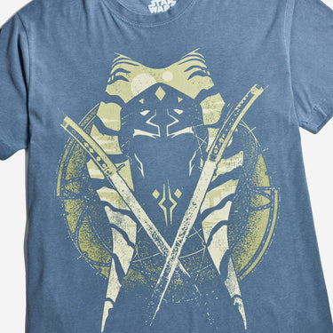A blue crewneck t-shirt featuring a distressed graphic of Ahsoka Tano's face, crossed lightsabers, and a circular emblem on the front, set against a plain light gray background.