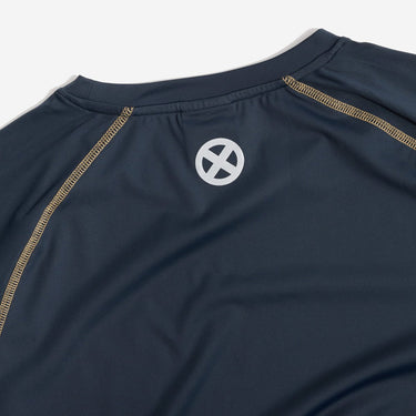 Navy blue athletic shirt with a white logo on a light gray background