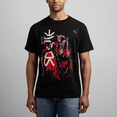 Person wearing a Black Star Wars t-shirt with a graphic design of Darth Talon holding a lightsaber on a white background