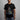 Person wearing a black t-shirt with a Marvel The Punisher Comic Book graphic design on a gray background